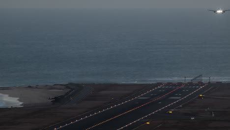 Airplane-landing-on-the-runway-at-sunset