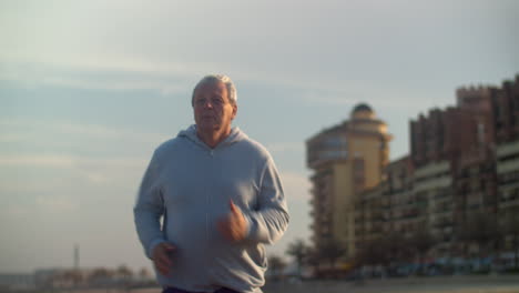 Senior-man-having-everyday-jogging-training