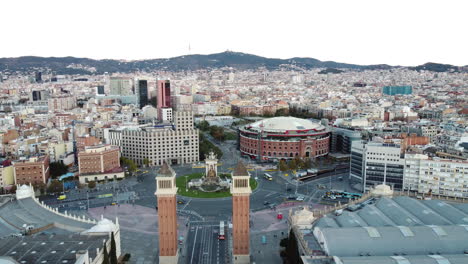 Flying-over-Barcelona-with-Spain-Square-and-residential-quarters