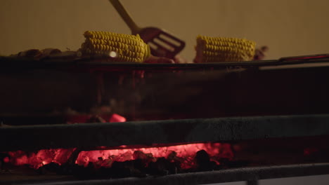 Roasting-meat-and-corn-on-charcoal-grill