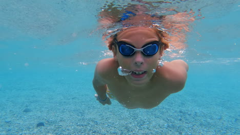 Slow-motion---teenager-swims-underwater