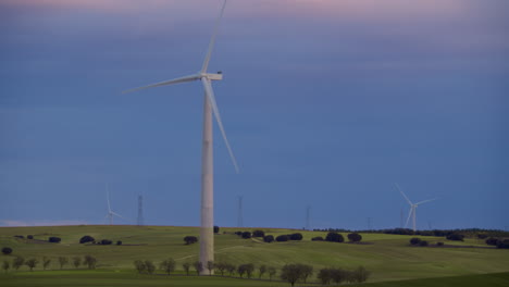Windmill-Generator-in-Sunset-Field