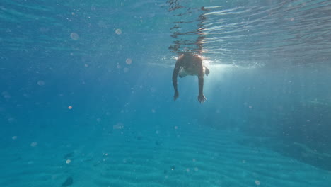 Teenager-dives-underwater