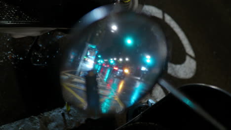 Transport-traffic-under-the-night-rain-motorbike-mirror-reflection