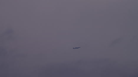 Wide-shot-of-airplane-in-the-fog-and-clouds