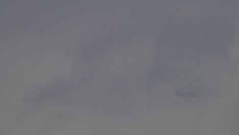 Passenger-airplane-is-flying-in-the-clouds-and-fog