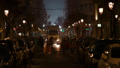 Night-street-with-people-walking-and-truck-on-the-road-Spain