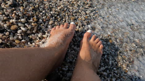 Slow-motion---womans-feet-in-sea-foam