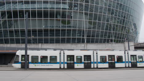Tram-passes-by-against-an-office-building