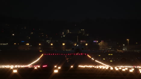 Airplane-landing-at-night-airport