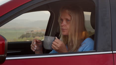 Woman-car-traveler-taking-a-rest-with-hot-tea
