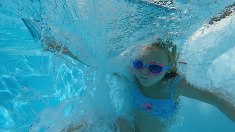 Girl-jumps-into-pool-with-spin---slow-motion