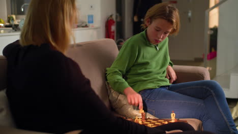 Playing-chess-with-mom-at-home-4