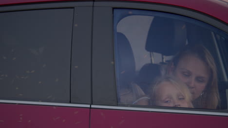 Woman-with-a-child-in-a-car
