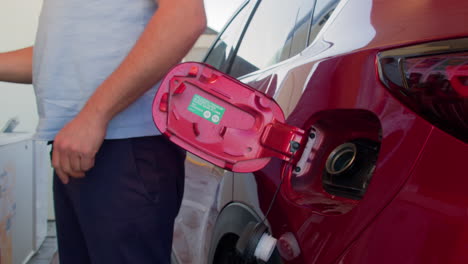 Man-fueling-his-car-with-gasoline