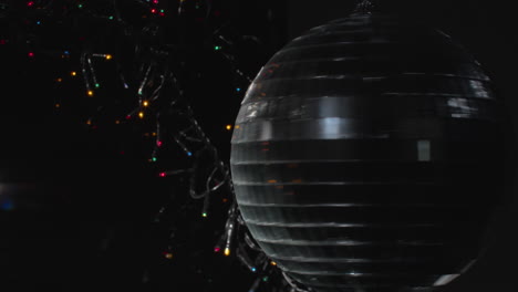 Spinning-disco-ball-with-new-year-lights