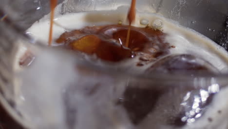 Coffee-being-poured-into-a-glass-with-ice