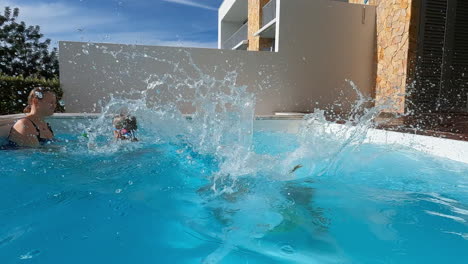Boy-pool-jump-with-family