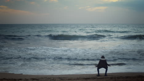 Dancing-boy-on-ocean-shore