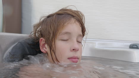 Teen-enjoys-in-a-hot-tub