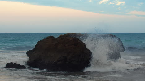 Waves-crashing-on-boulder