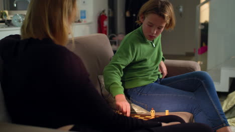 Playing-chess-with-mom-at-home-3