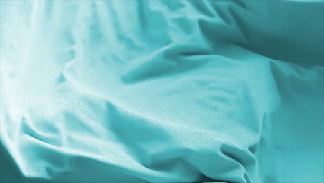Closeup-of-a-Gentle-Aqua-or-Turquoise-Fabric-Possibly-Soft-Cotton-or-Microfiber-with-Delicate-Folds