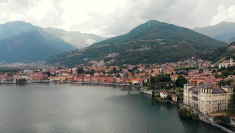 4K-panoramic-drone-footage-of-Domaso,-a-small-municipality-in-the-province-of-Como-in-the-Italian-region-of-Lombardy,-Italy-along-the-mountains-and-the-coast-of-Lake-Como