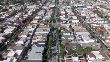 Flying-Above-Long-Beach-City,-Los-Angeles-CA-USA,-Street-Traffic-and-Buildings-on-Hot-Sunny-Day