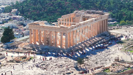 Tight-circling-aerial-shot-of-the-Parthenon-surrounded-by-tourists