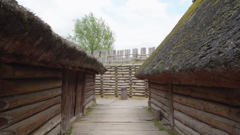 thatched-roofs-Inside-an-archaeological-site-of-Biskupin-and-a-life-size-model-of-a-late-Bronze-Age-fortified-settlement-in-Poland