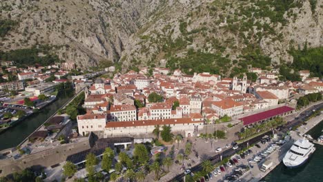 Stunning-aerial-view-of-the-old-coastal-town-Kotor,-limestone-cliffs-of-Orjen-and-Lovćen