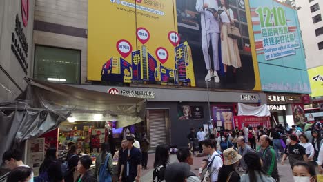 Handheld-panning,-exit-of-Mass-Transit-Railway,-Mong-Kok-Station,-Hong-Kong