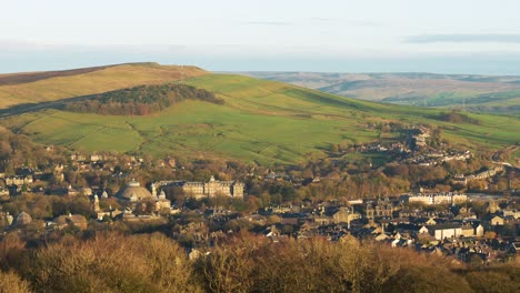 Scenic-view-of-small-English-town-surrounded-by-rolling-hills