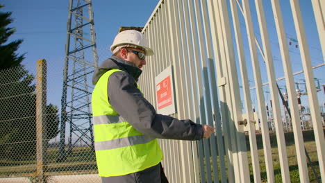 Manager-wearing-personal-protective-clothing-arrives-secure-power-substation