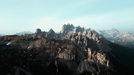 Beautiful-aerial-alpine-mountain-top-rangelandscape,-dramatic-steep-scenery