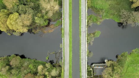 Narrow-green-Grand-Canal-at-River-Liffey-Kildare-Ireland-drone-aerial
