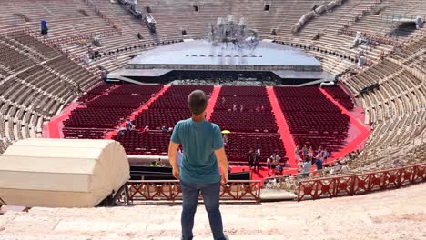 Young-man-contemplating-Arena-di-Verona-ready-for-opera-concert