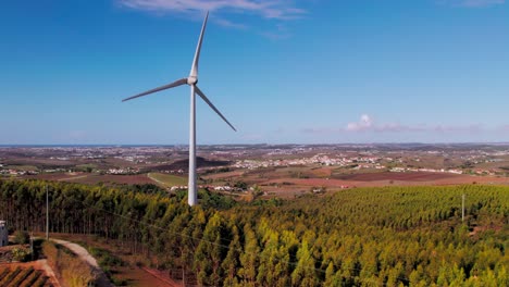 Wind-turbines-near-a-village-in-Torres-Vedras,-Portugal