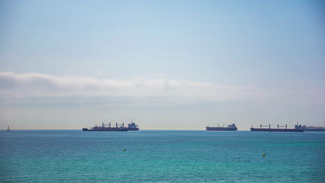 Empty-container-ships-anchored-near-Malaga,-Spain