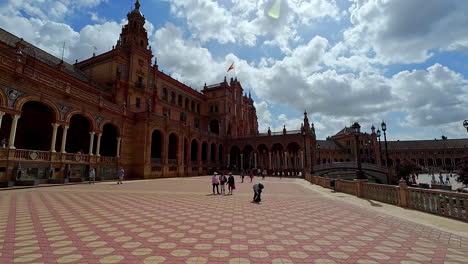 Travelers-On-The-Yard-Of-Plaza-De-Espana-In-Seville,-Andalucia,-Spain