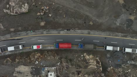 Aerial-drone-top-down-shot-over-the-congested-road-along-the-mountain-slope-after-landslide-over-Skardu-road,-Pakistan-at-daytime