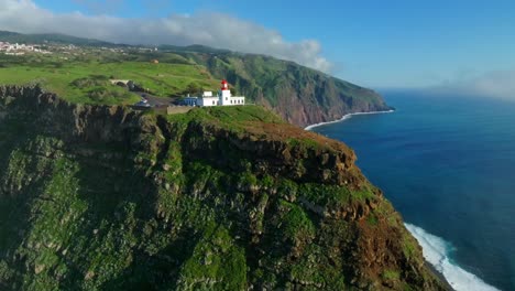 Aerial-pullback-from-Ponta-do-Pargo-lighthouse-in-Madeira-Portugal-on-sunny-day