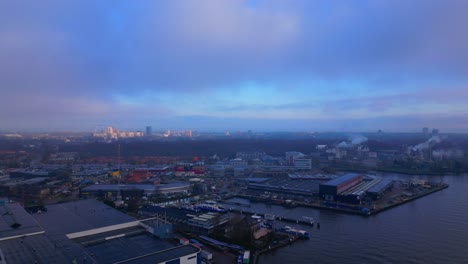 Orbital-Panoramic-View-over-Industrial-Area-in-Amsterdam-North-Sea-Canal-at-Sunset