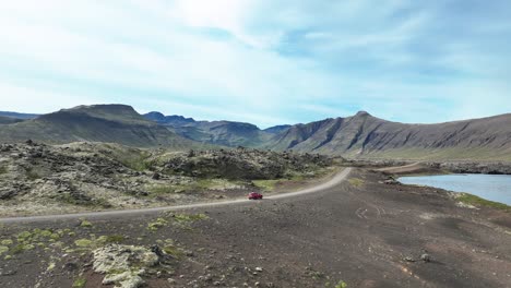 Car-Driving-Across-The-Road-Through-Huge-Berserkjahraun-Lava-Field,-Snaefellsnes-Peninsula,-West-Island