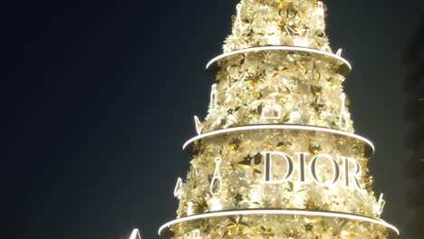 H-Handheld-reveal,-beautiful-tall-Christian-Dior-inspired-Christmas-tree