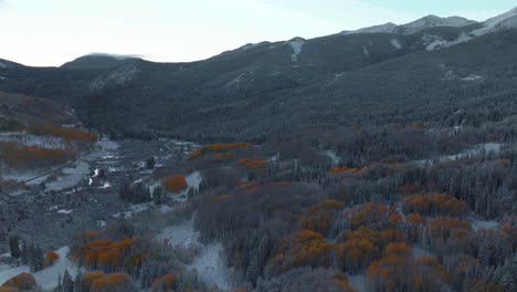 Frosted-crisp-cold-freezing-frozen-morning-shaded-Kebler-Pass-Colorado-aerial-cinematic-drone-fall-winter-season-collide-first-white-snow-red-yellow-orange-aspen-tree-forest-shade-forward