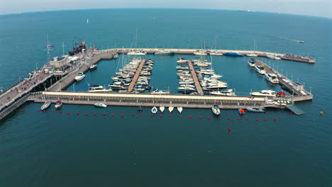 Aerial-shot-of-beautiful-marina-with-luxurious-yachts-at-sunny-day