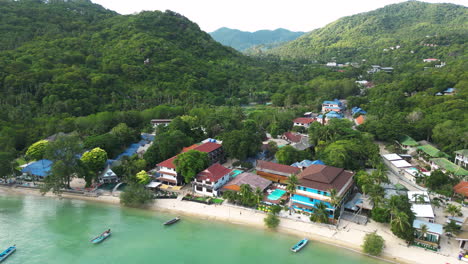 Koh-Tao-Thailand-South-east-asia,-drone-fly-above-resort-beach-town-with-fancy-luxury-hotel