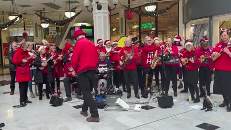 A-Christmas-choir-in-red-uniforms-entertains-shoppers-in-St-Stephen's-Green-Shopping-Centre